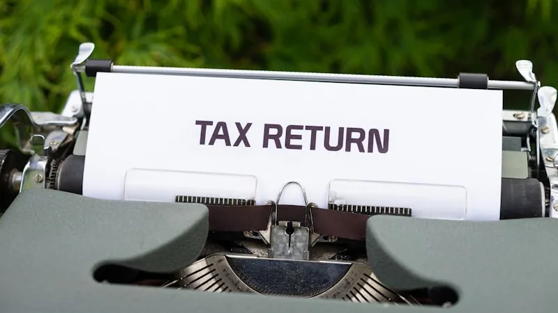 A sheet of paper reading Tax Return in an old typewriter